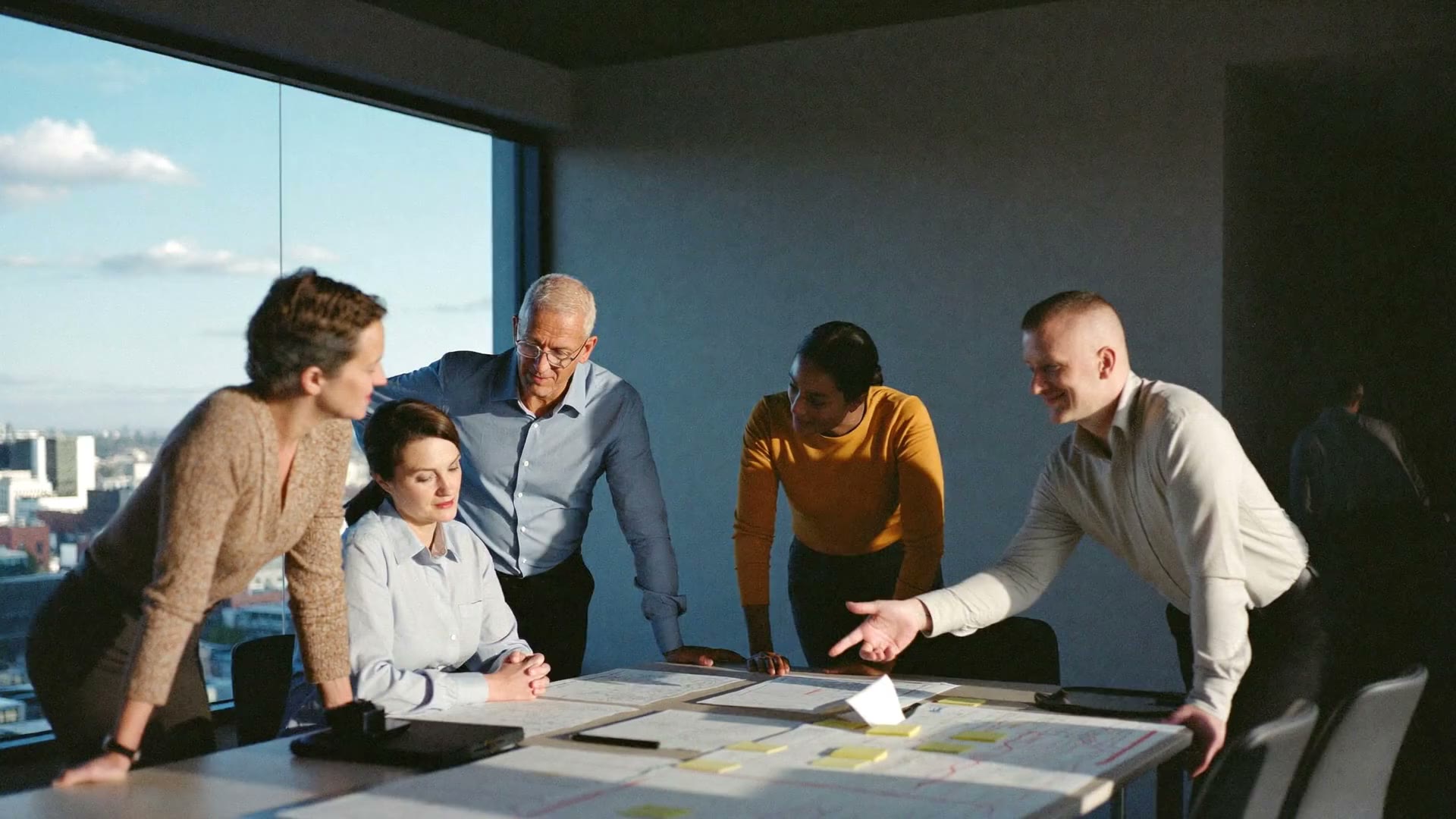 A leadership team over the maps of their business